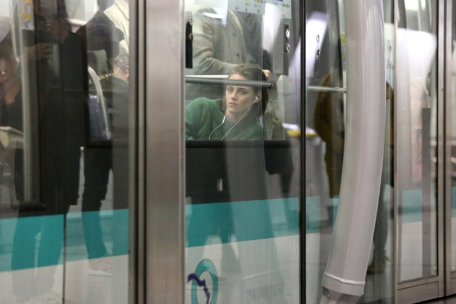 Actress Kristen Stewart riding the metro for the film "Personal Shopper"