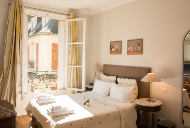 A bedroom in the Cognac apartment, courtesy of Paris Perfect