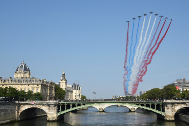 Paris Celebrates a Monumental Weekend: Pomp, Pride, Partying, and Freedom