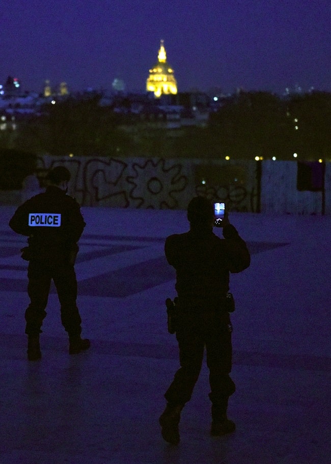 The police also appreciate the beauty of Paris at night.