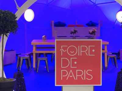 An event space with Foire De Paris Banner