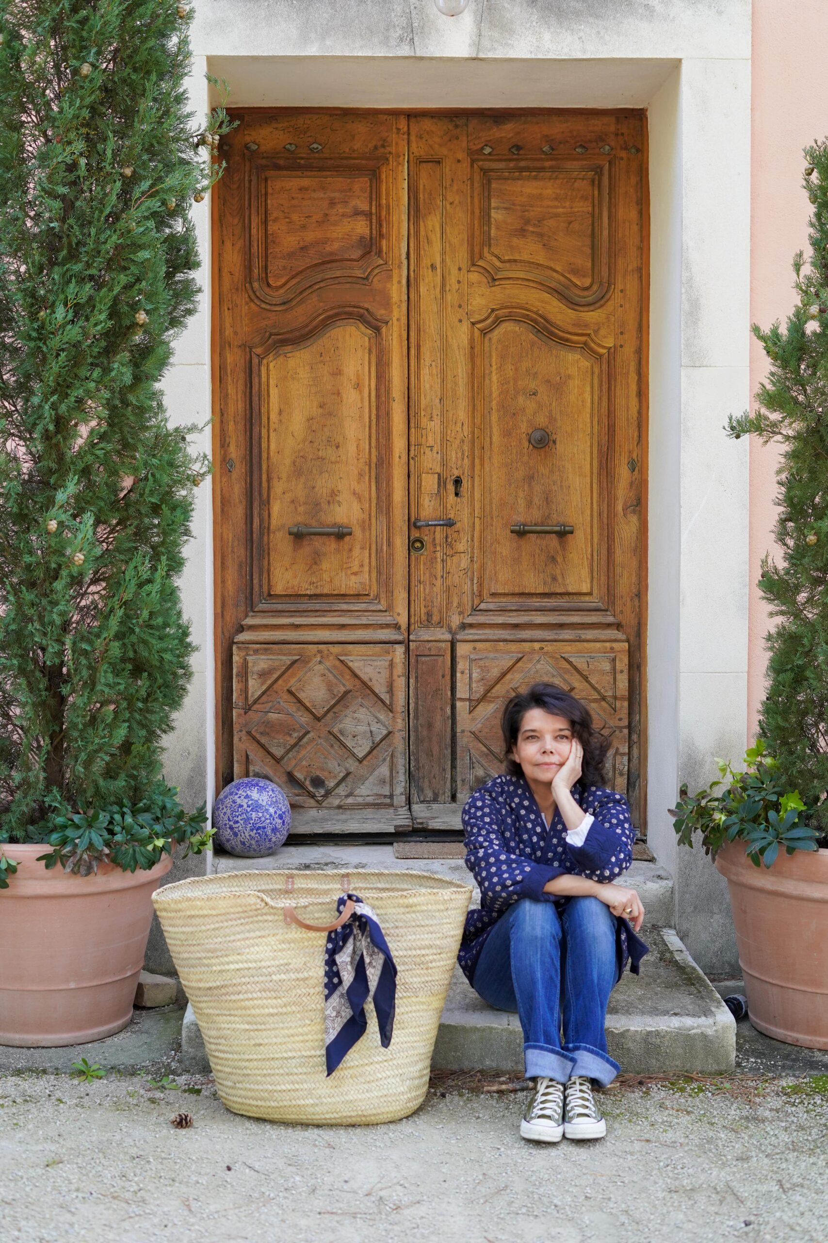 A lady in front of a door