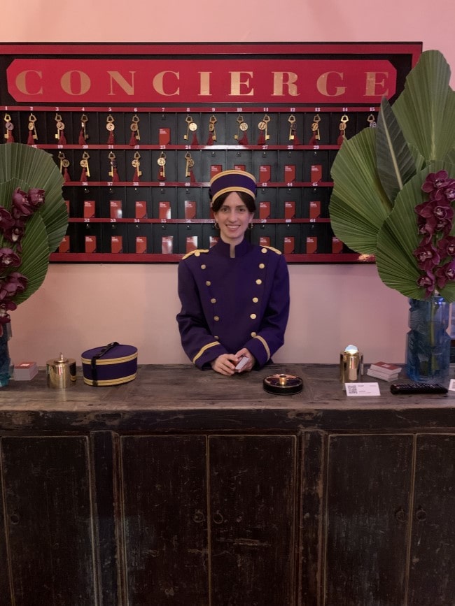 a lady waiting by a counter