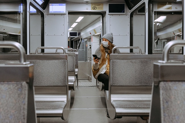 Woman Wearing Mask on Train