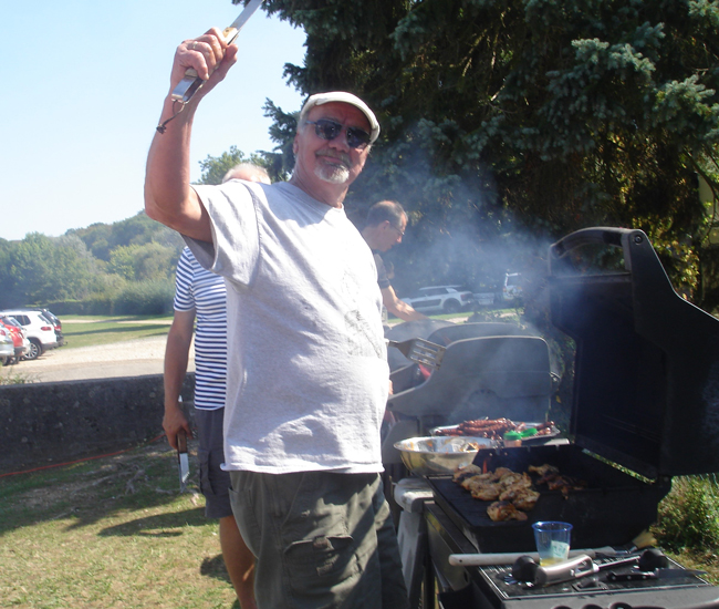 Men Grilling at Town Fête