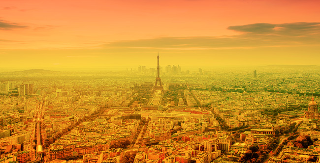 heat wave in Paris, France - burning orange sun and Eiffel tower