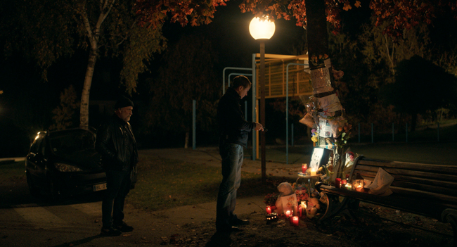 Man looking at a memorial