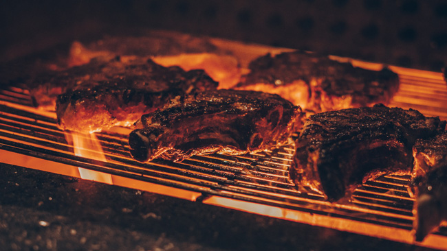 Grilled meat on barbecue