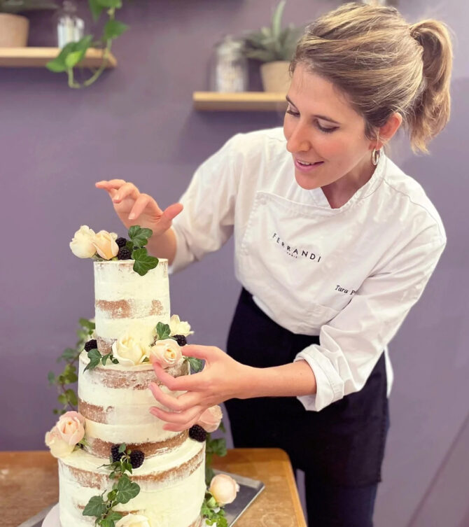 Photo of Tara Pidoux decorating a cake