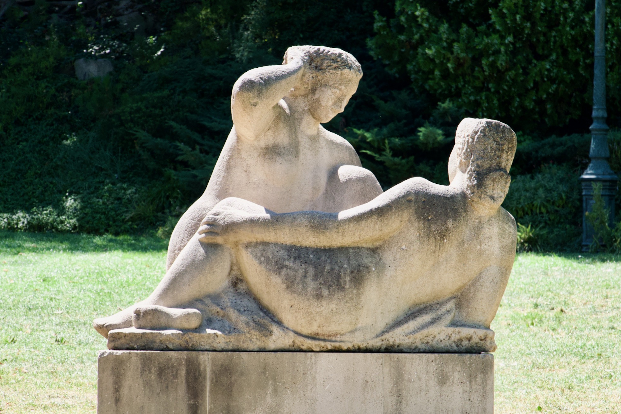 A stone statue of a couple