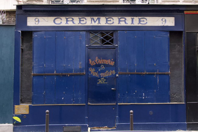 Boarded up Cremerie shopfront