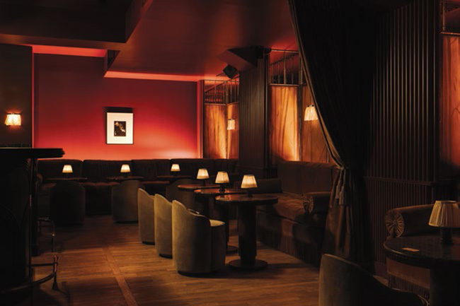 A red dance bar with plush and warm seats