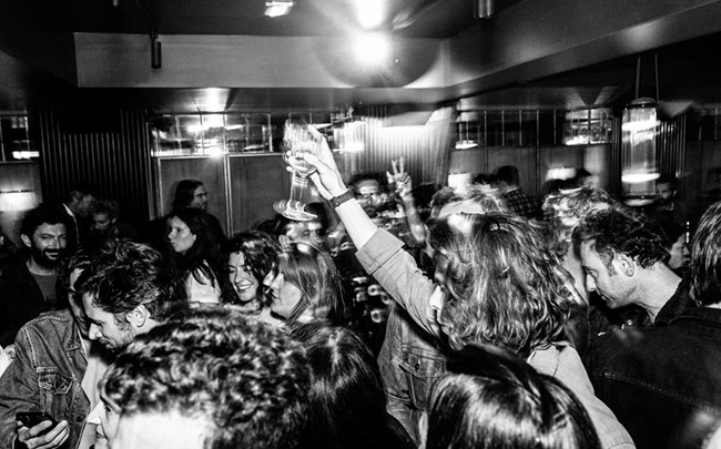 black and white photo of people dancing at le Mikado