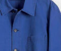 Blue vetra shirt on a hanger