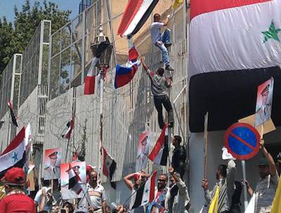 Aljazeera photo of French embassy in Syria under attack