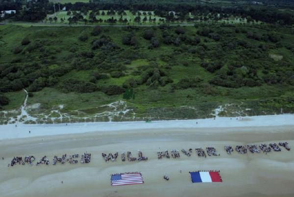 Past memorial event at Omaha Beach presented by The French Will Never Forget. 