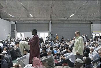French Muslims attend a mass prayer at a prayer hall in a unused former fire station, Paris, September 16, 2011. Photo: AP