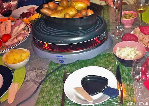 Raclette iron w/cured meats, vegetables, fruit and wine. Photo: ParisDali