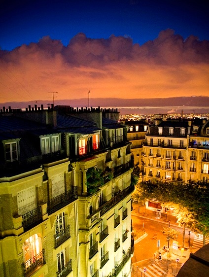 From Montmartre, one can watch the skies change over Paris. Photo by jorgealbarracin.