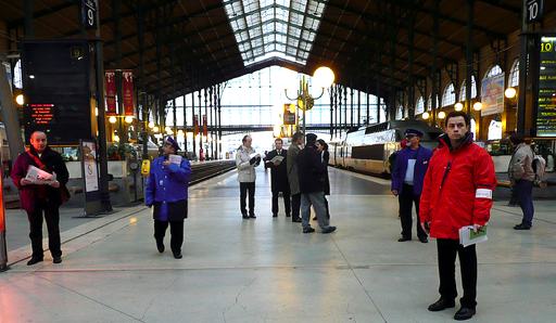 Uniformed workers assist travelers at rail stations. Photo: malias